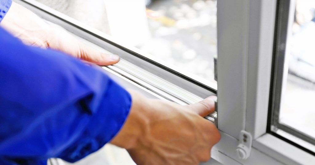 Construction worker putting sealing